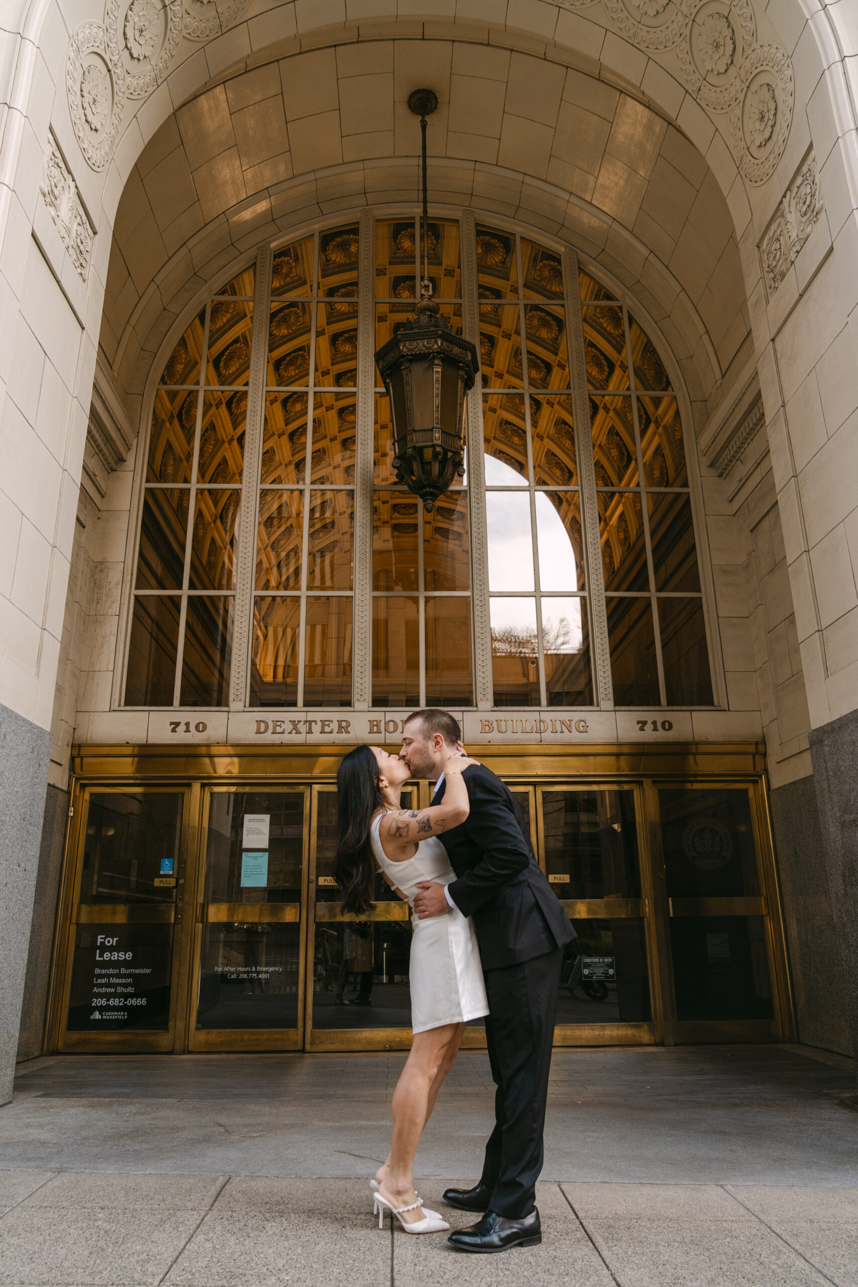 Engaged couple kissing in downtown city